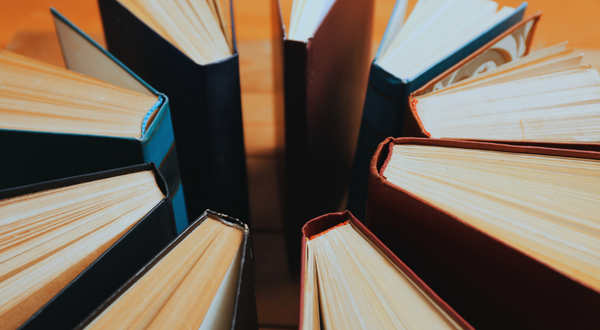 A circle of upright books, spines facing inward