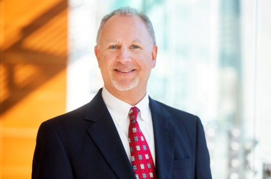 Portrait of Wayne A. Mehlman of the American Council of Life Insurers (ACLI) wearing a suit and red patterned tie.
