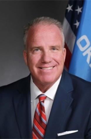 Headshot of OK Insurance Commissioner Glen Mulready